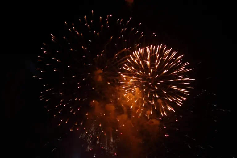 Fireworks lighting the night sky during a Calpe fiesta celebration.