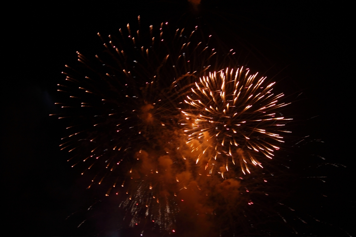 Fireworks lighting the night sky during a Calpe fiesta celebration.