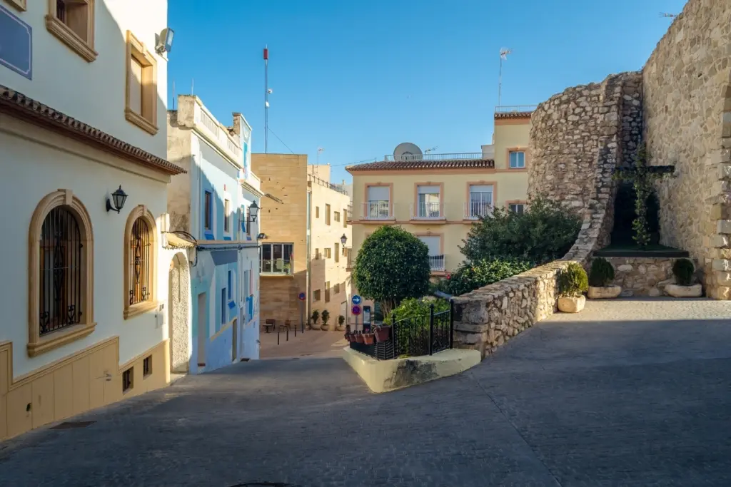Historic streets, stone walls and colourful buildings in Calpe Old Town