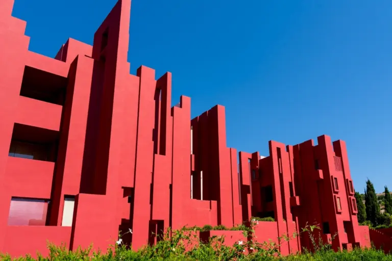 Red exterior of La Muralla Roja in Calpe, designed by Ricardo Bofill