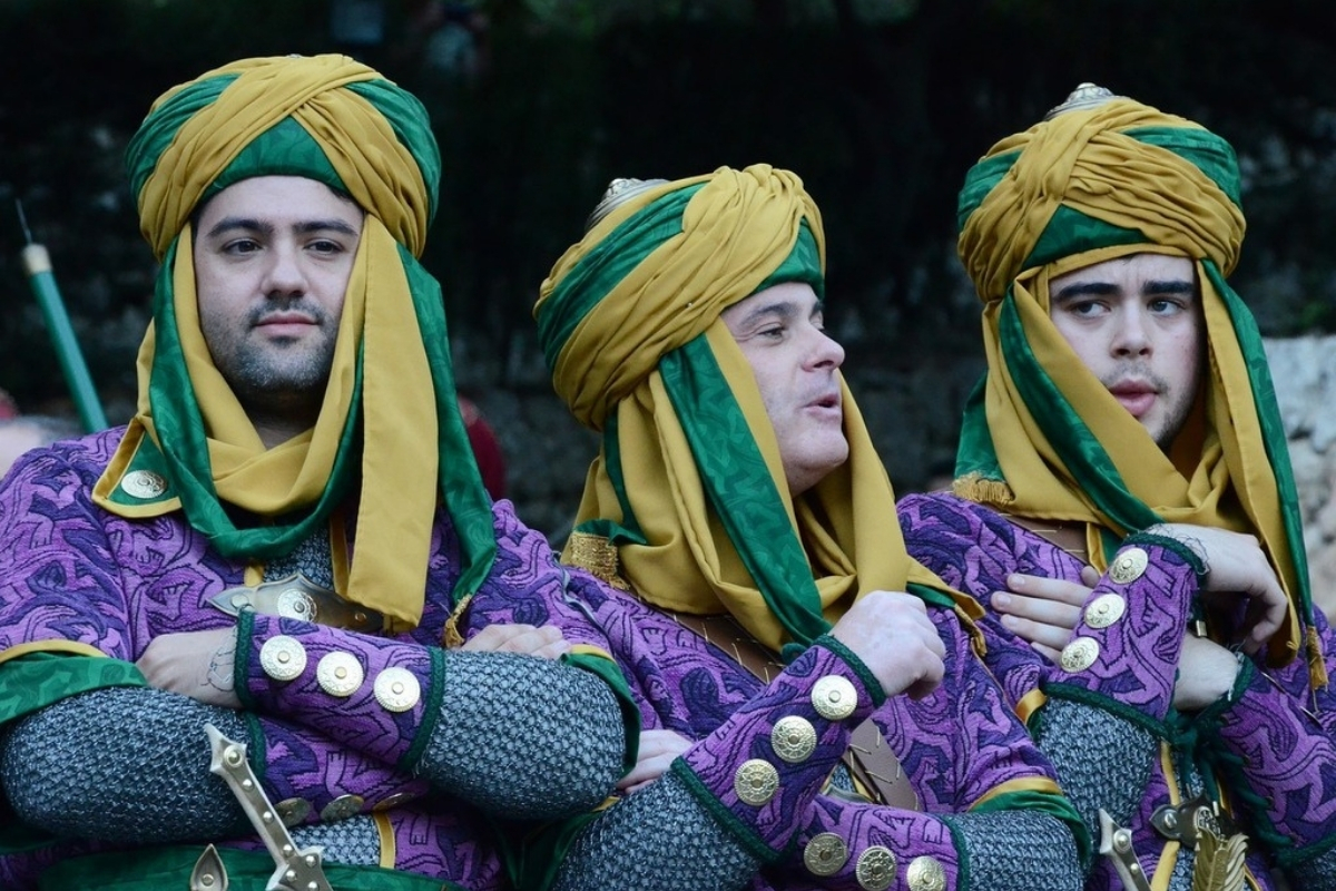 Participants wearing traditional Moorish costumes during the Moors and Christians festival in Calpe
