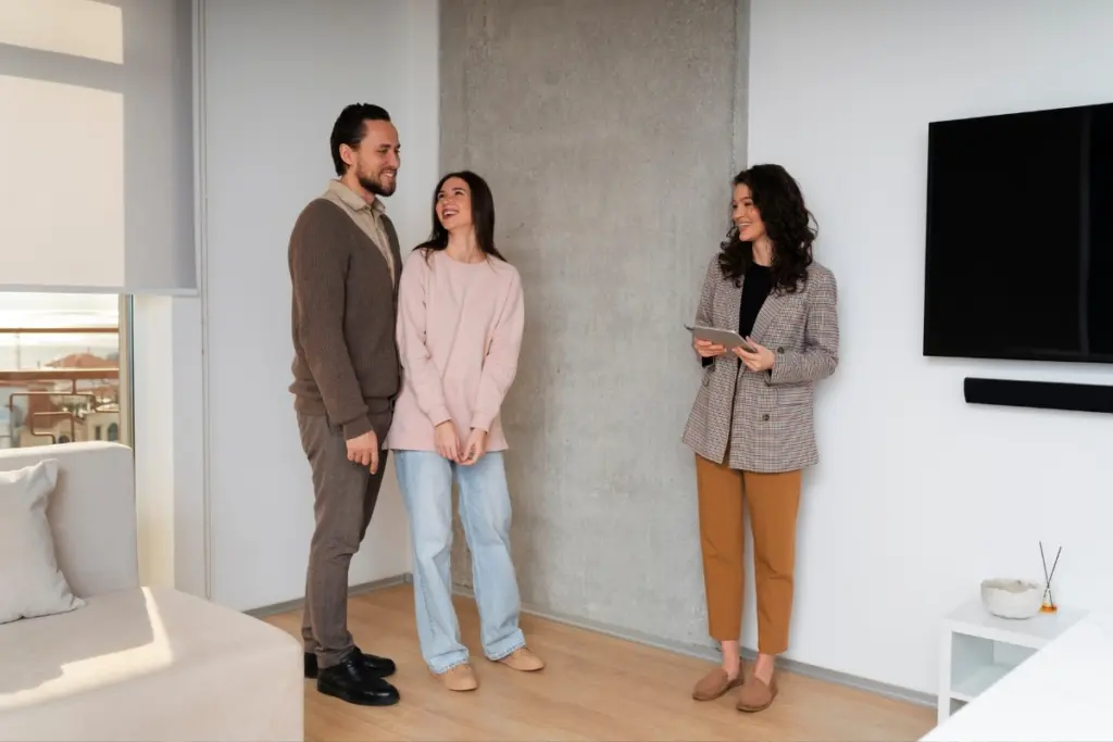 Couple viewing an apartment with a real estate agent