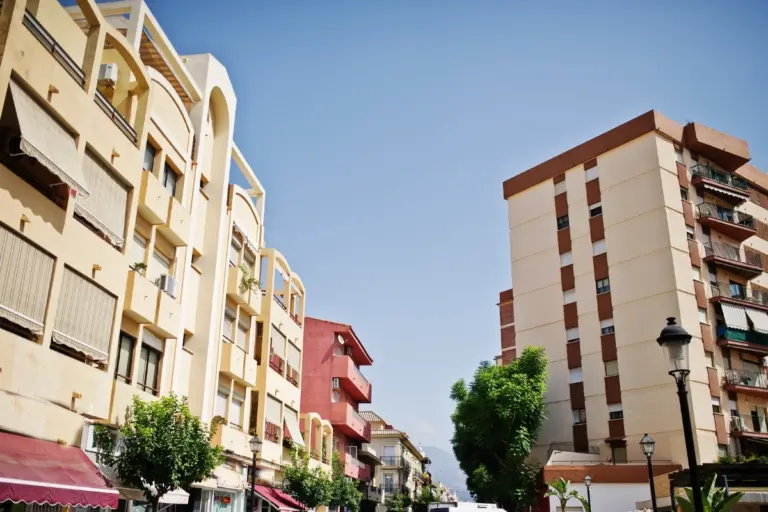 Apartment buildings on a sunny street in Calpe town centre.