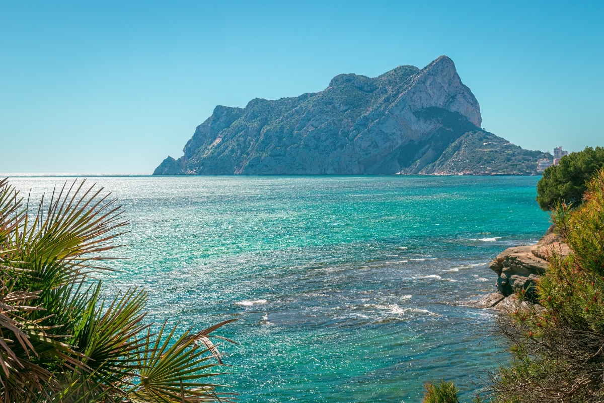 Peñón de Ifach above the turquoise Mediterranean Sea in Calpe during summer